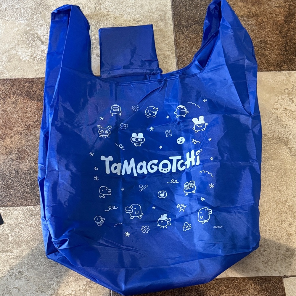 SDCC 2025 tamagotchi bag Blue Tamagotchi Tote Bag limited edition w/ Avatar book